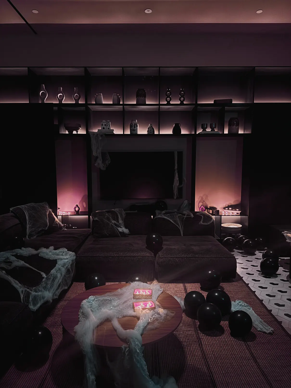 A dark room lit in purple for Halloween